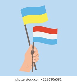 Flags of Ukraine and Luxembourg, Hand Holding flags