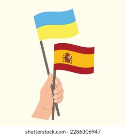 Flags of Ukraine and Spain, Hand Holding flags