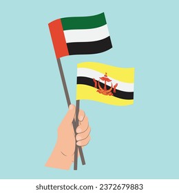 Flags of the United Arab Emirates and Brunei, Hand Holding flags