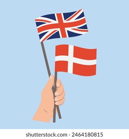 Flags the United Kingdom of Great Britain and Northern Ireland and Denmark, Hand Holding flags