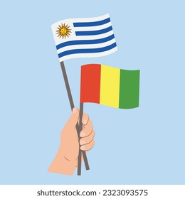 Flags of Uruguay and Guinea, Hand Holding flags