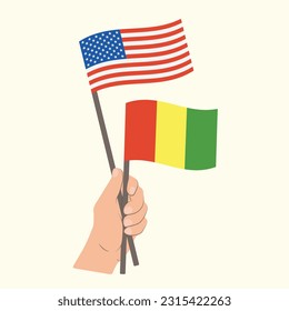 Flags of the USA and Guinea, Hand Holding flags