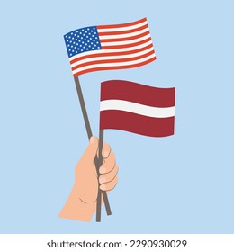 Flags of USA and Latvia, Hand Holding flags