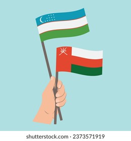 Flags of Uzbekistan and Oman, Hand Holding flags