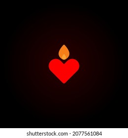 The flame illuminates the red heart in the dark