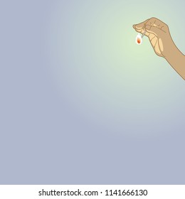 Flame of a match that illuminates the darkness