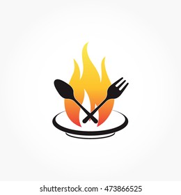 flaming fire on a plate with spoon and fork