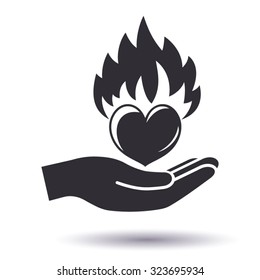 Flaming heart in hand. Passionate love concept icon