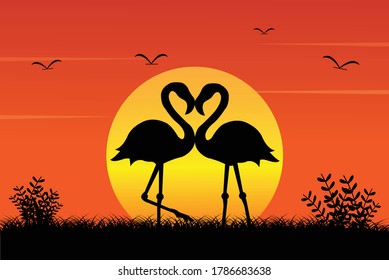 Flamingo couple and sunset silhouette