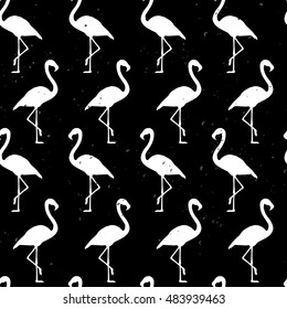 Flamingo fabric design for textile, book cover, web. Vector. White flamingos on black grunge background. Seamless pattern. Flamingo Exotic Hawaii bird.