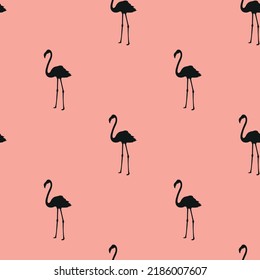 Flamingo seamless pattern. Black flamingo silhouette repeating on pink background. Design for fashion, fabric, web, wallpaper and all prints. Vector illustration.