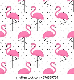 Flamingo seamless pattern on polka dots background. Flamingo vector background design for fabric and decor.