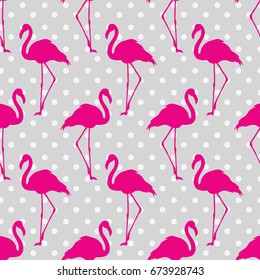 Flamingo seamless pattern on polka dots background. Flamingo vector background design for fabric and decor.