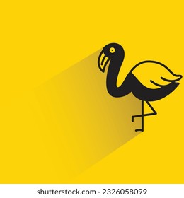flamingo with shadow on yellow background