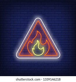 Flammable neon sign. Flame in triangle on brick wall background. Vector illustration in neon style for billboards, signboards, warning signs