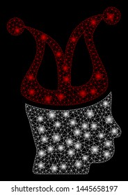 Flare mesh joker with lightspot effect. Abstract illuminated model of joker icon. Shiny wire frame triangular mesh joker. Vector abstraction on a black background.