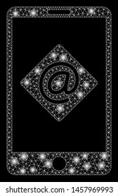 Flare mesh mobile email with lightspot effect. Abstract illuminated model of mobile email icon. Shiny wire frame triangular mesh mobile email. Vector abstraction on a black background.