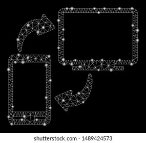 Flare mesh phone-desktop sync with glare effect. Abstract illuminated model of phone-desktop sync icon. Shiny wire carcass triangular mesh phone-desktop sync. Vector abstraction on a black background.