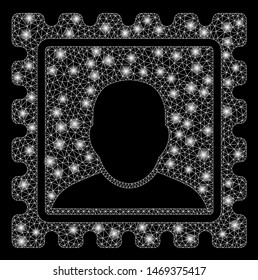 Flare mesh postal mark with lightspot effect. Abstract illuminated model of postal mark icon. Shiny wire carcass polygonal mesh postal mark. Vector abstraction on a black background.