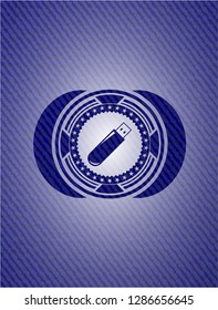 flash drive icon inside badge with denim texture