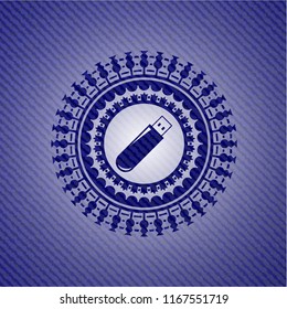 flash drive icon inside emblem with denim high quality background