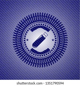 flash drive icon inside emblem with denim texture