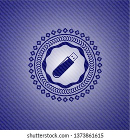 flash drive icon inside emblem with denim texture