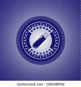flash drive icon inside jean or denim emblem or badge background