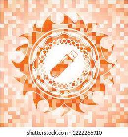 flash drive icon inside orange mosaic emblem