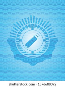 flash drive icon inside sky blue water emblem.
