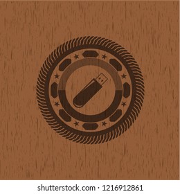 flash drive icon inside wood badge or emblem