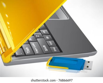 flash drive on white keyboard.