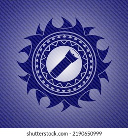 flashlight icon inside badge with denim texture. 