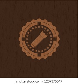 flashlight icon inside badge with wooden background