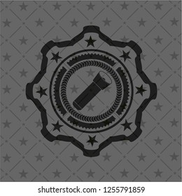 flashlight icon inside black emblem
