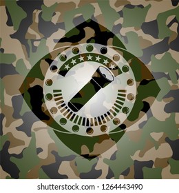 flashlight icon inside camouflaged emblem