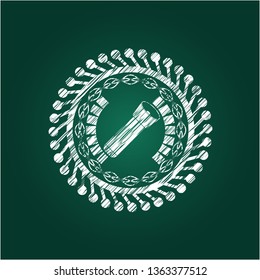 flashlight icon inside chalk emblem written on a blackboard