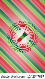 flashlight icon inside christmas badge.