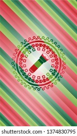 flashlight icon inside christmas badge.