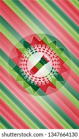 flashlight icon inside christmas colors style emblem.