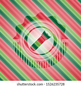 flashlight icon inside christmas style badge..