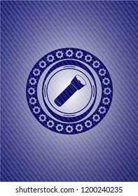 flashlight icon inside emblem with denim texture