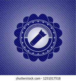 flashlight icon inside emblem with denim texture