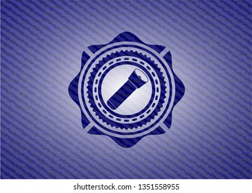 flashlight icon inside emblem with denim texture