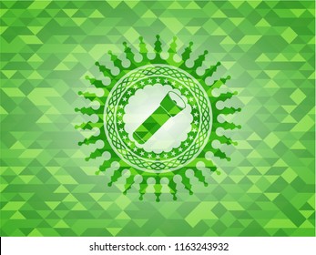 flashlight icon inside green emblem with triangle mosaic background