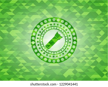 flashlight icon inside green emblem. Mosaic background