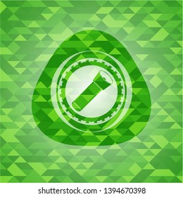 flashlight icon inside green emblem with mosaic background