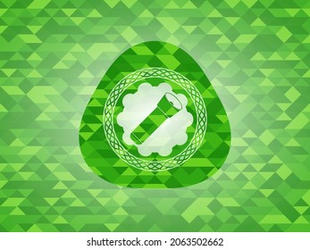 flashlight icon inside green emblem with mosaic background. 