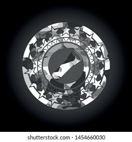 flashlight icon inside grey camo emblem