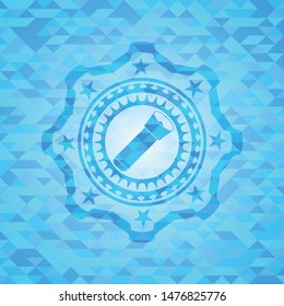 flashlight icon inside light blue mosaic emblem